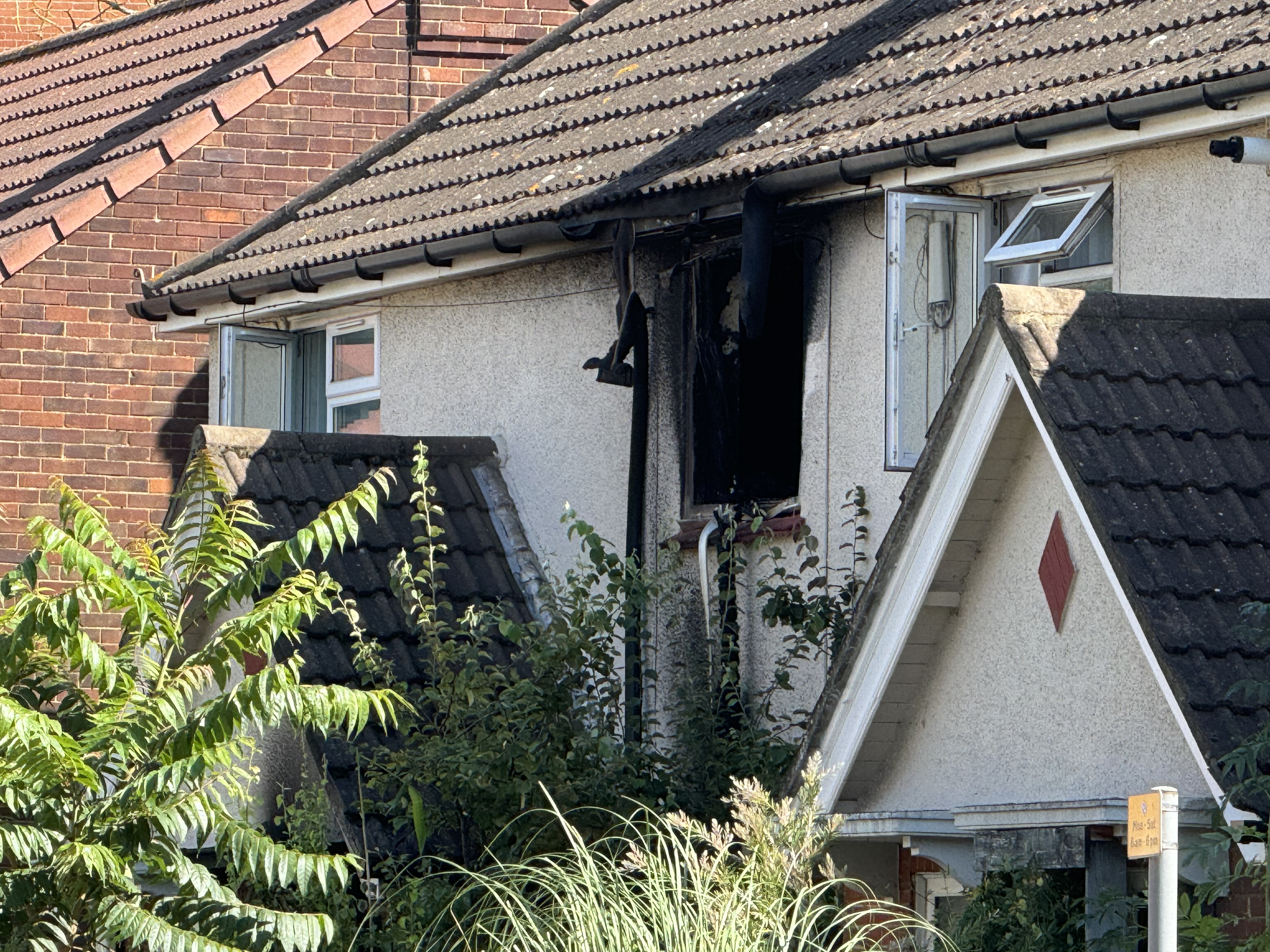 A burnt out window of a house on Portman Road