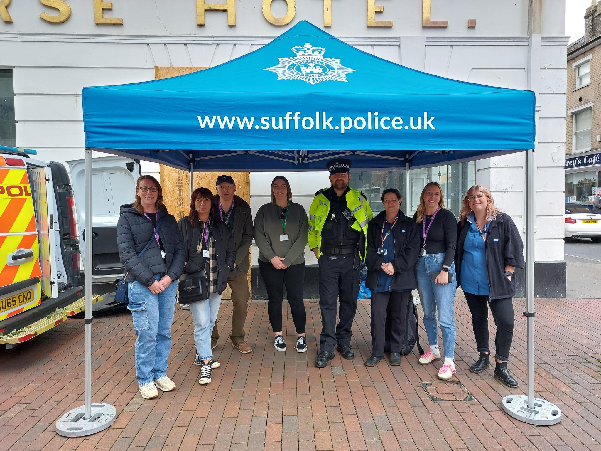 Police are joined by representatives from multiple agencies at a stand on Tavern Street, Ipswich