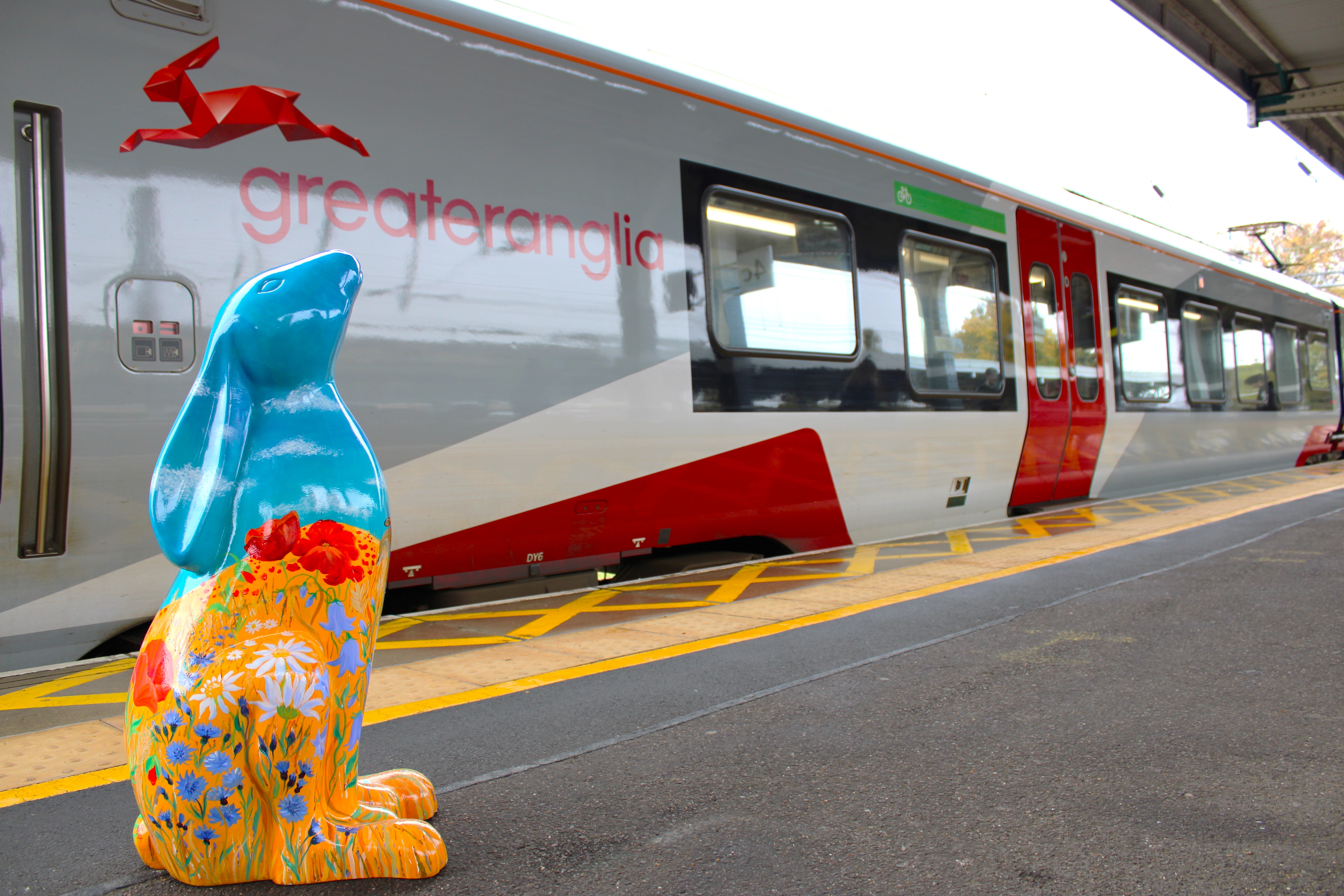 Hare sculpture on platform by train