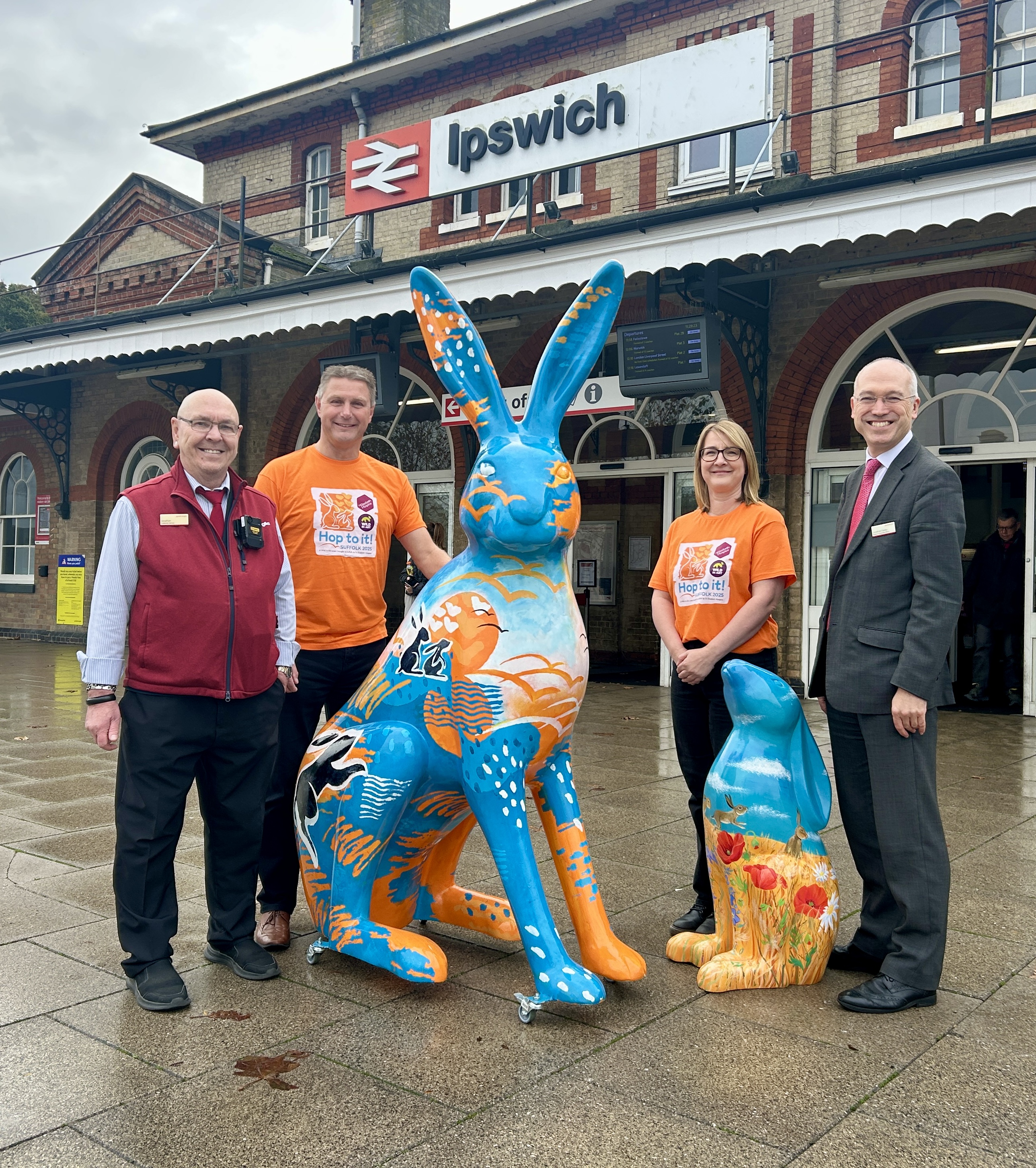 Hop to it team with Jonathan Denby outside train station