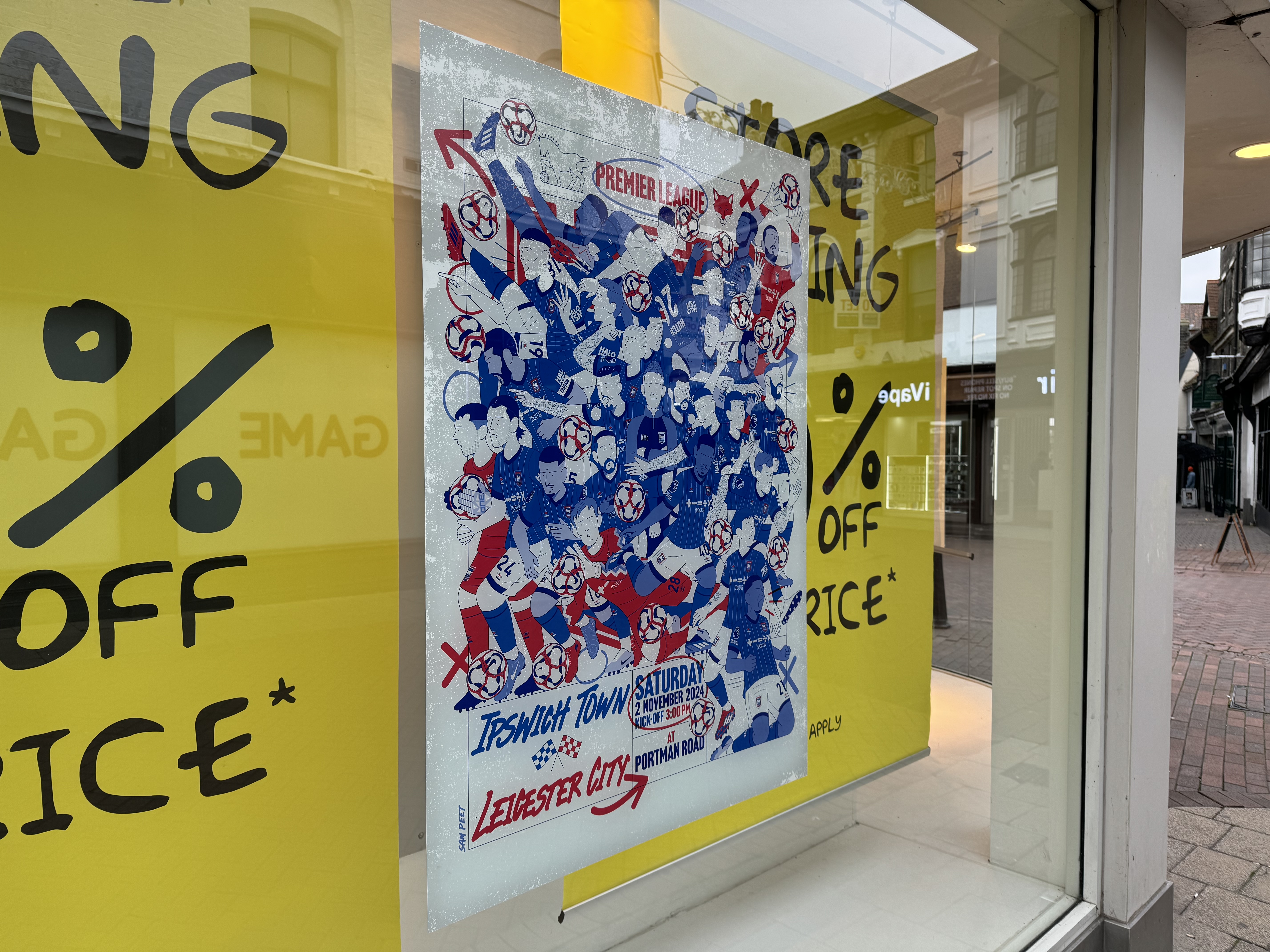 ITFC vs Leicester City poster in the window of the pop-up Sports Direct store