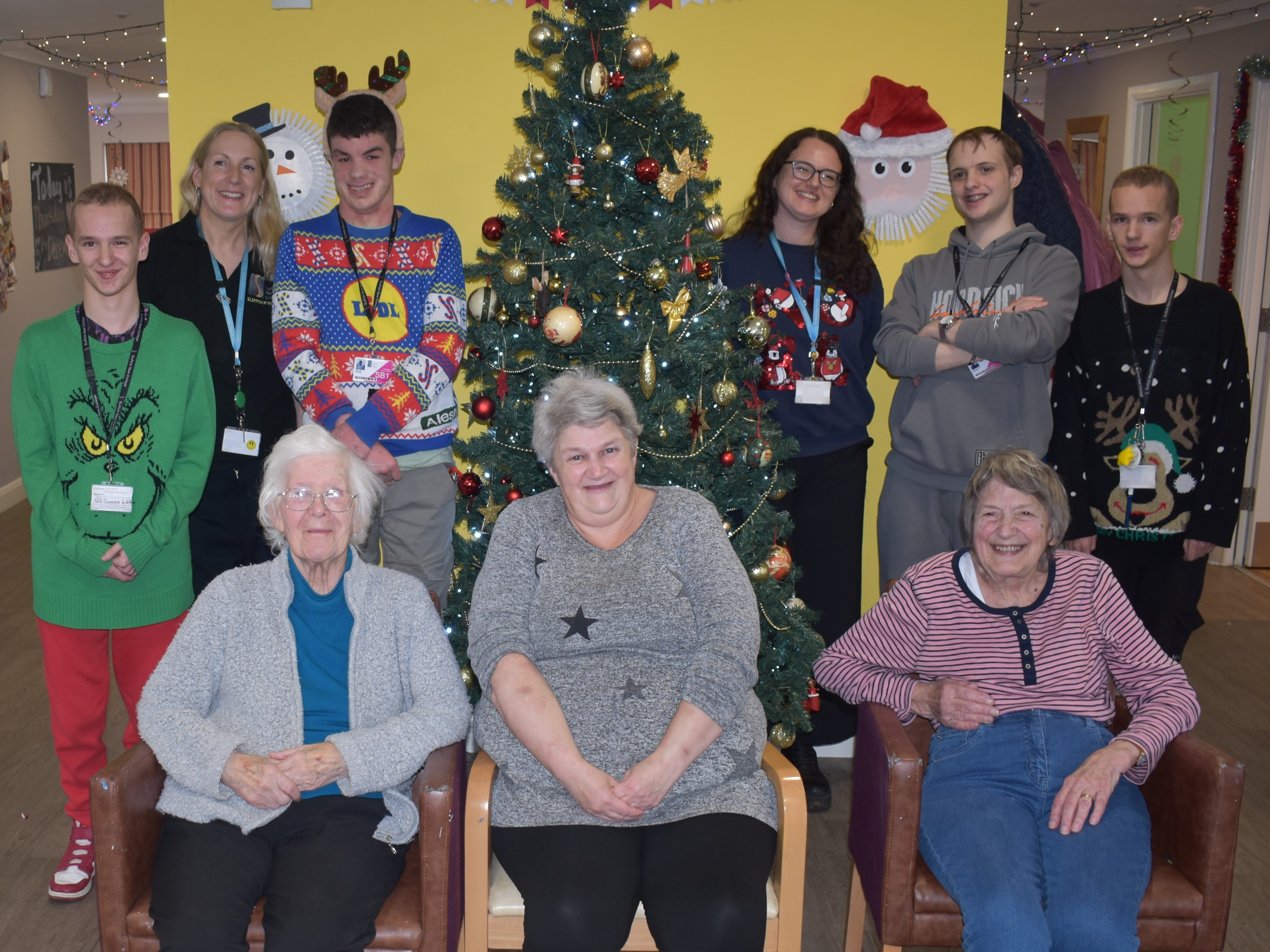 Mills Meadow day care members and students from Suffolk Rural College students at a festive party for people living with dementia