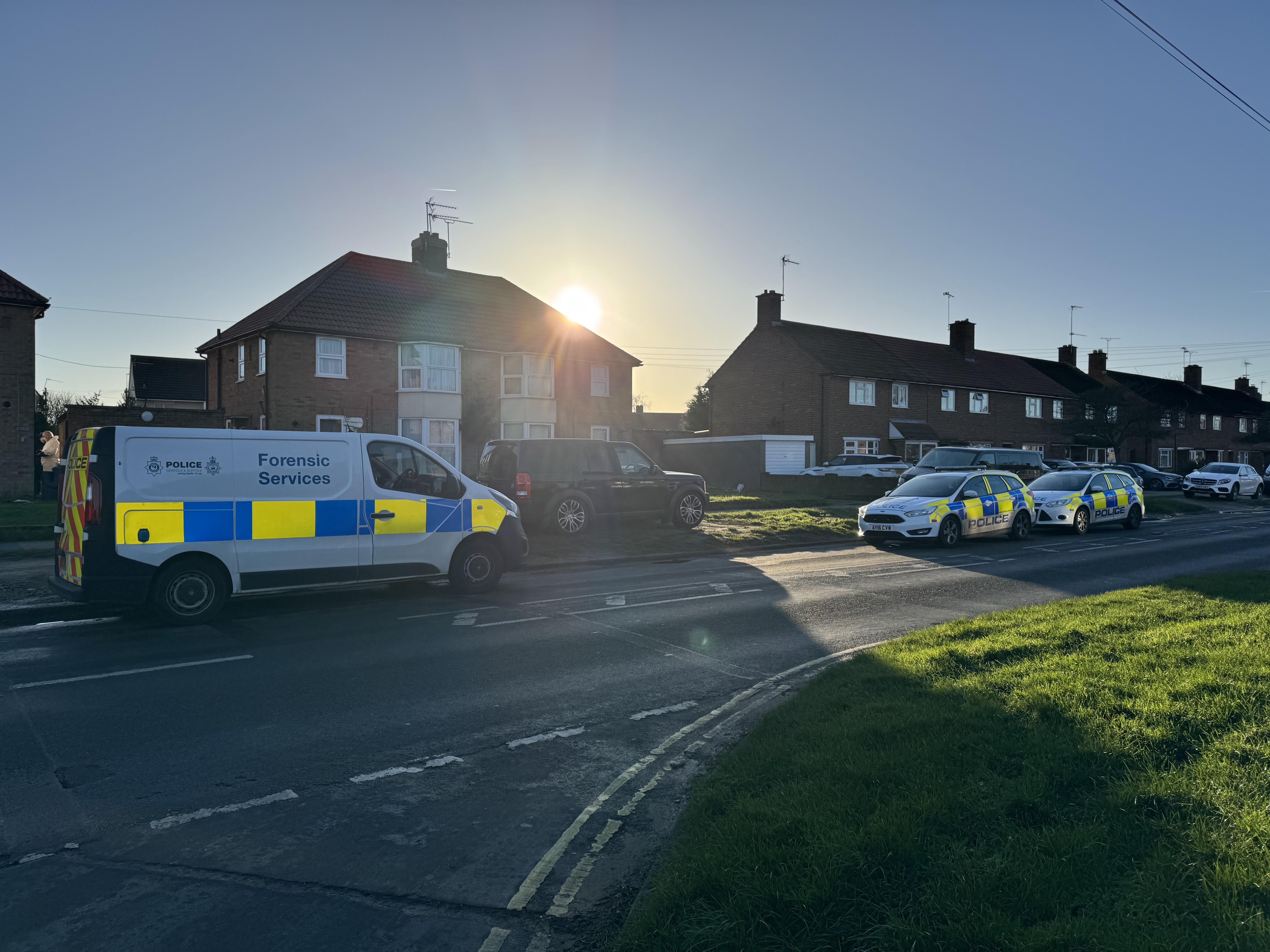 Two police cars and a forensics unit at an address on Hawthorn Drive, Ipswich