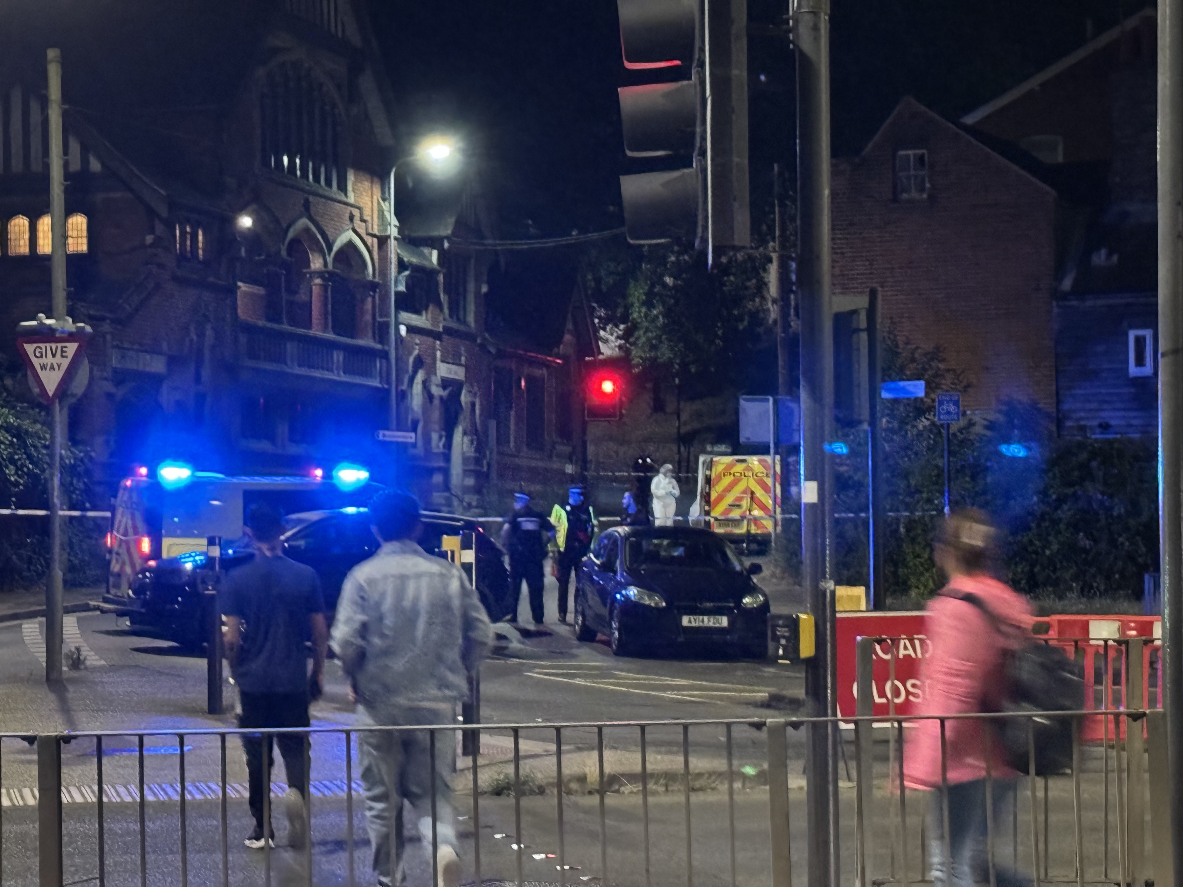 Police in forensic suits could be seen at the scene on Burrell Road