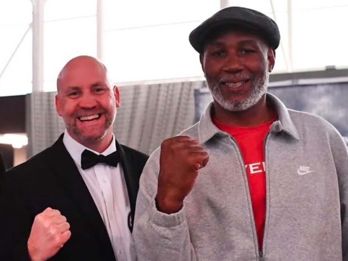 Simon Mullan with Lennox Lewis while refereeing at a tournament in Spain