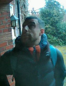 CCTV image of a man at someone's front door