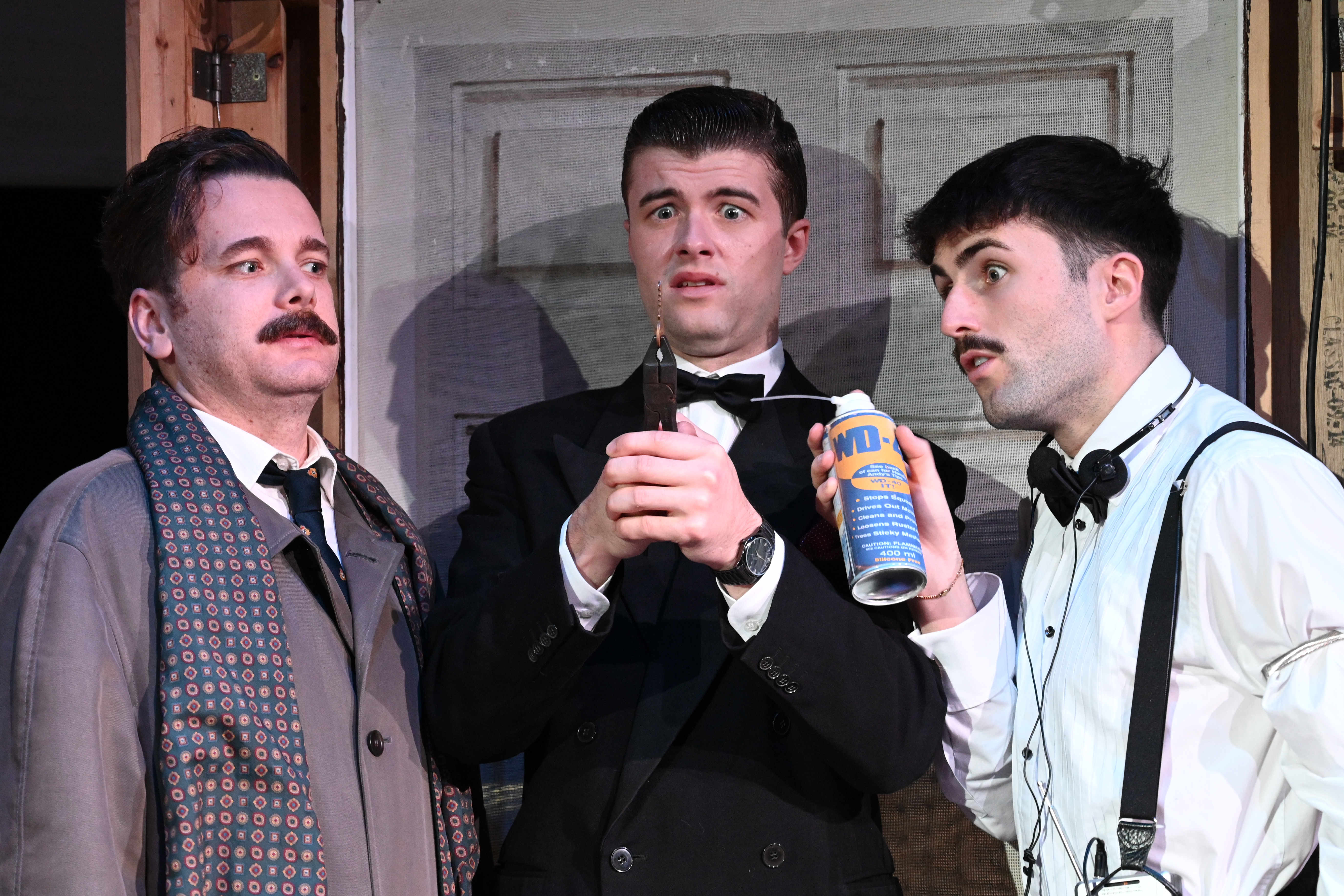 Cast members performing in Dial M for Mayhem