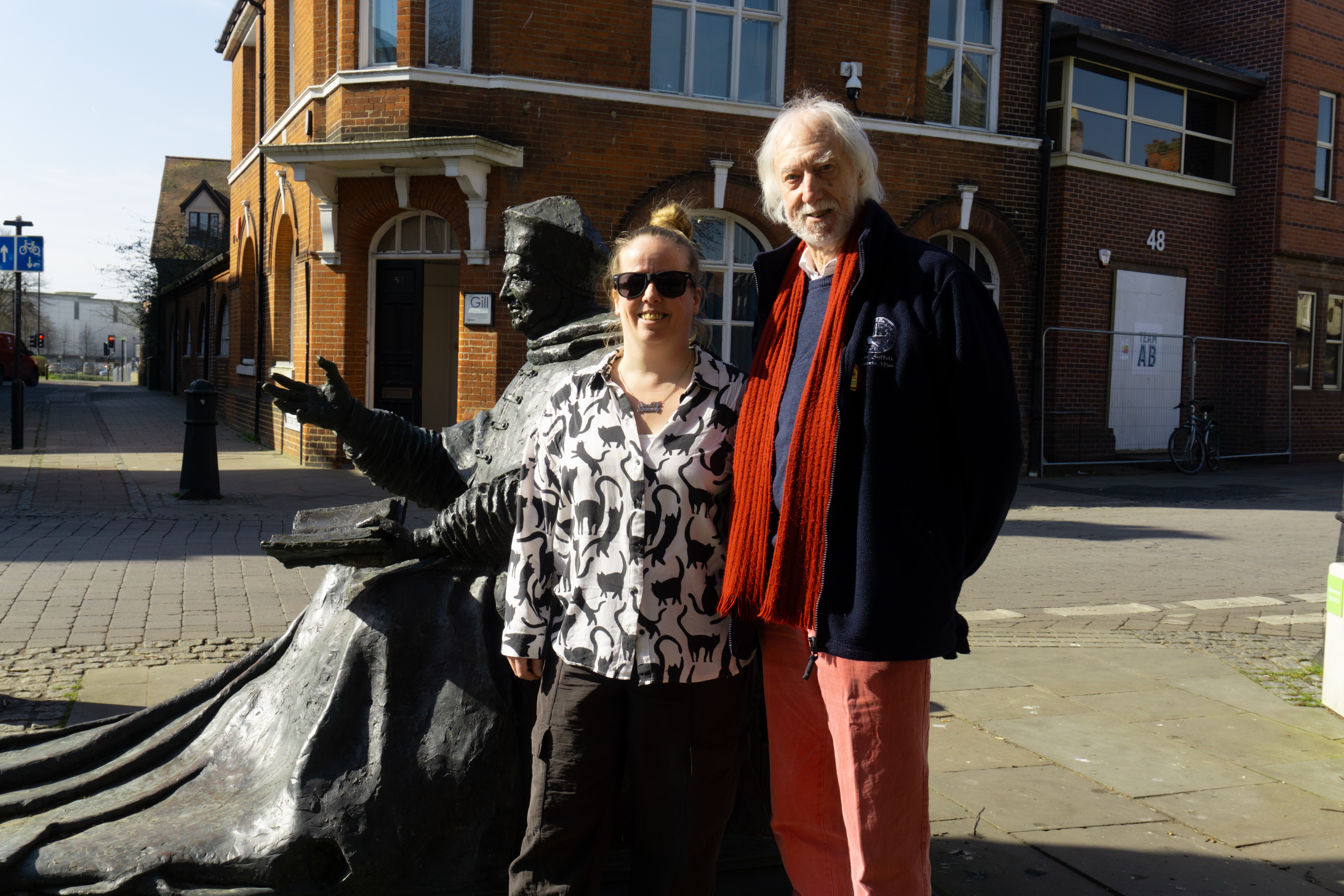 Amy and Mike posing in front of the Thomas Wolsey statue in Ipswich