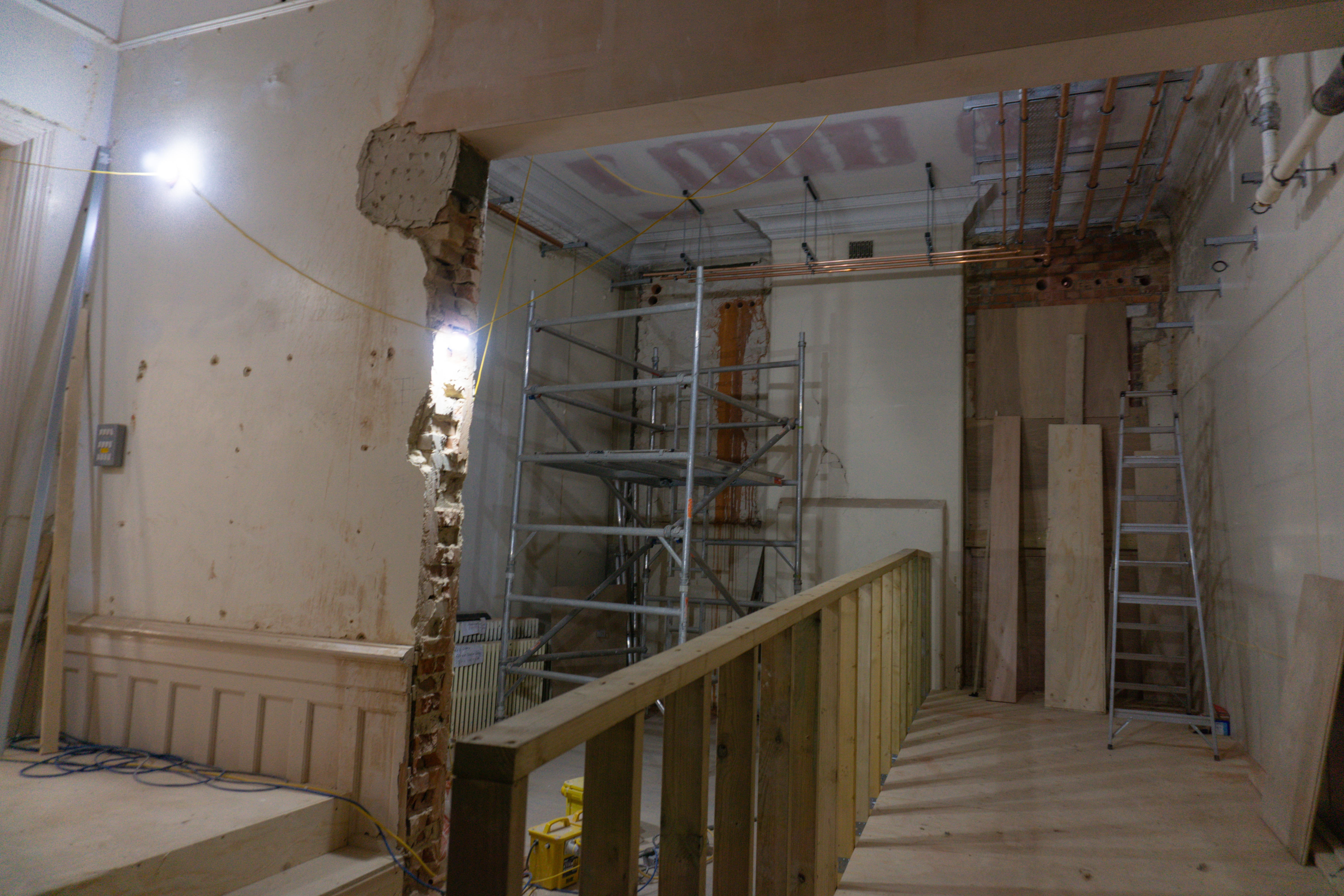 Progress of the interior renovations, including new raised floors for accessibility improvements, new cornice that matches the original and a lot of new plumbing