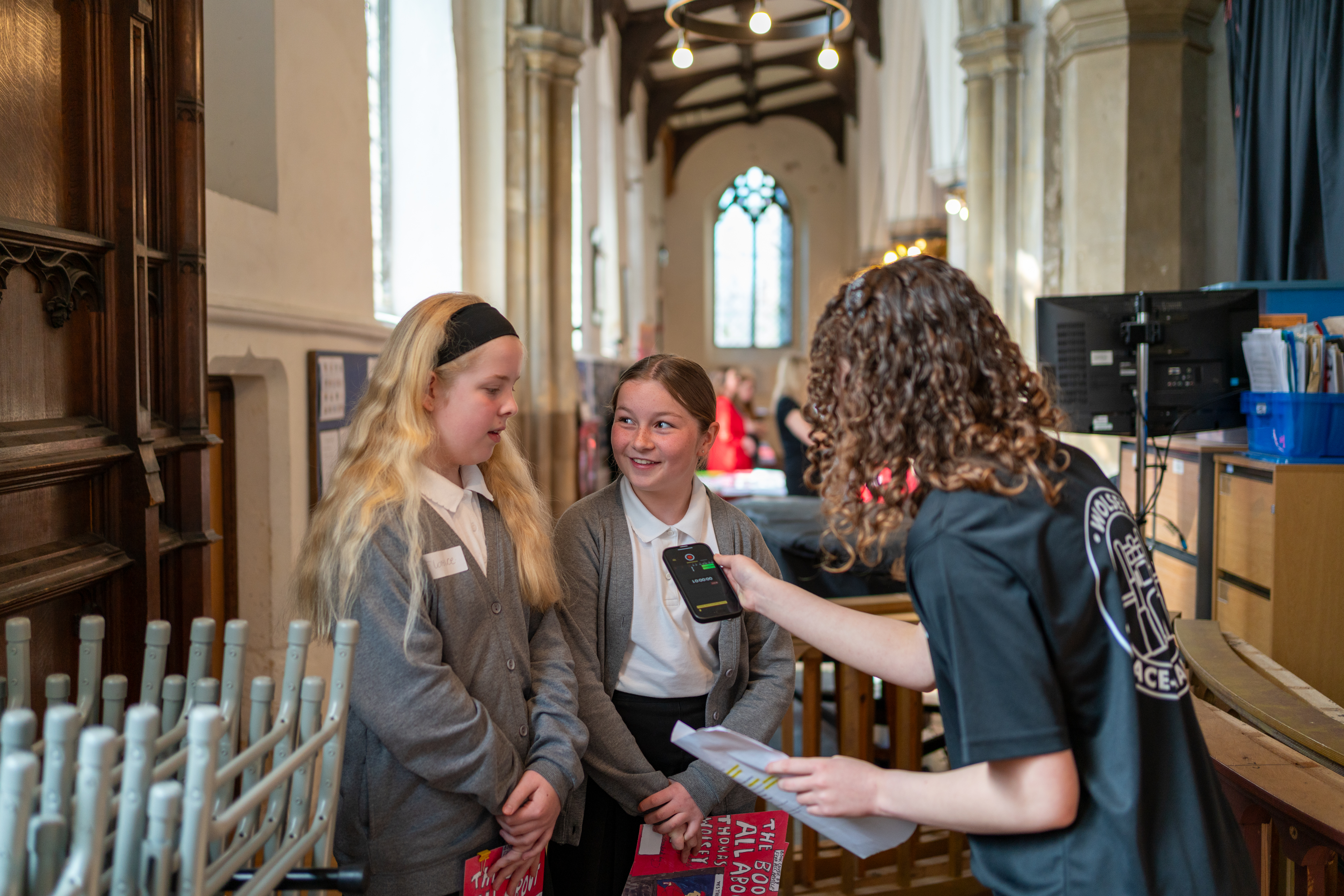 Two young people on Cardinal Wolsey Day at St Peter’s by the Waterfront being interviewed by a Wolsey Place Changer