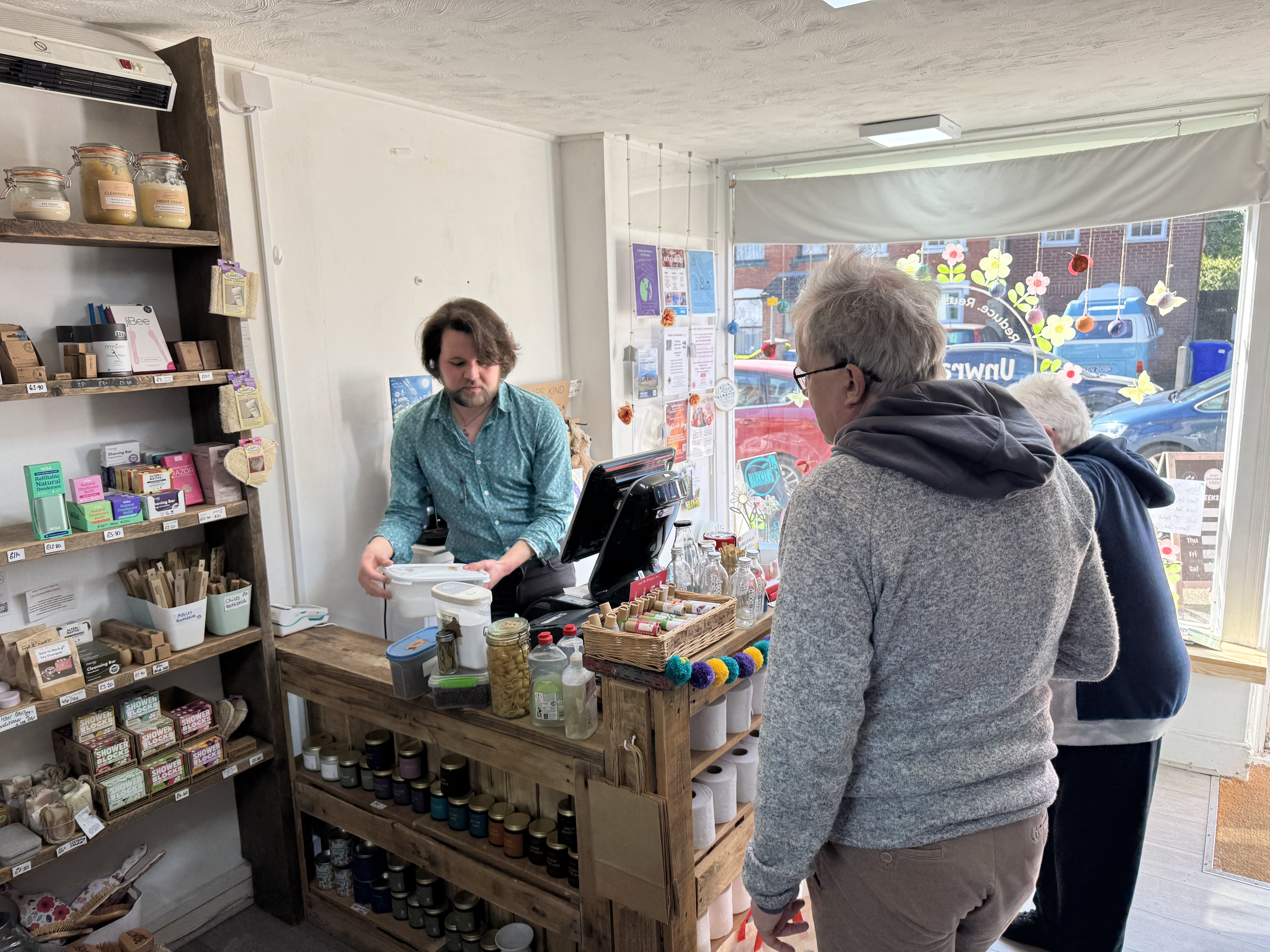 Beren manning the till at Unwrapped & Refill