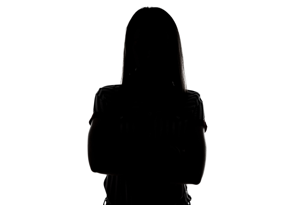 A silhouette of a female victim