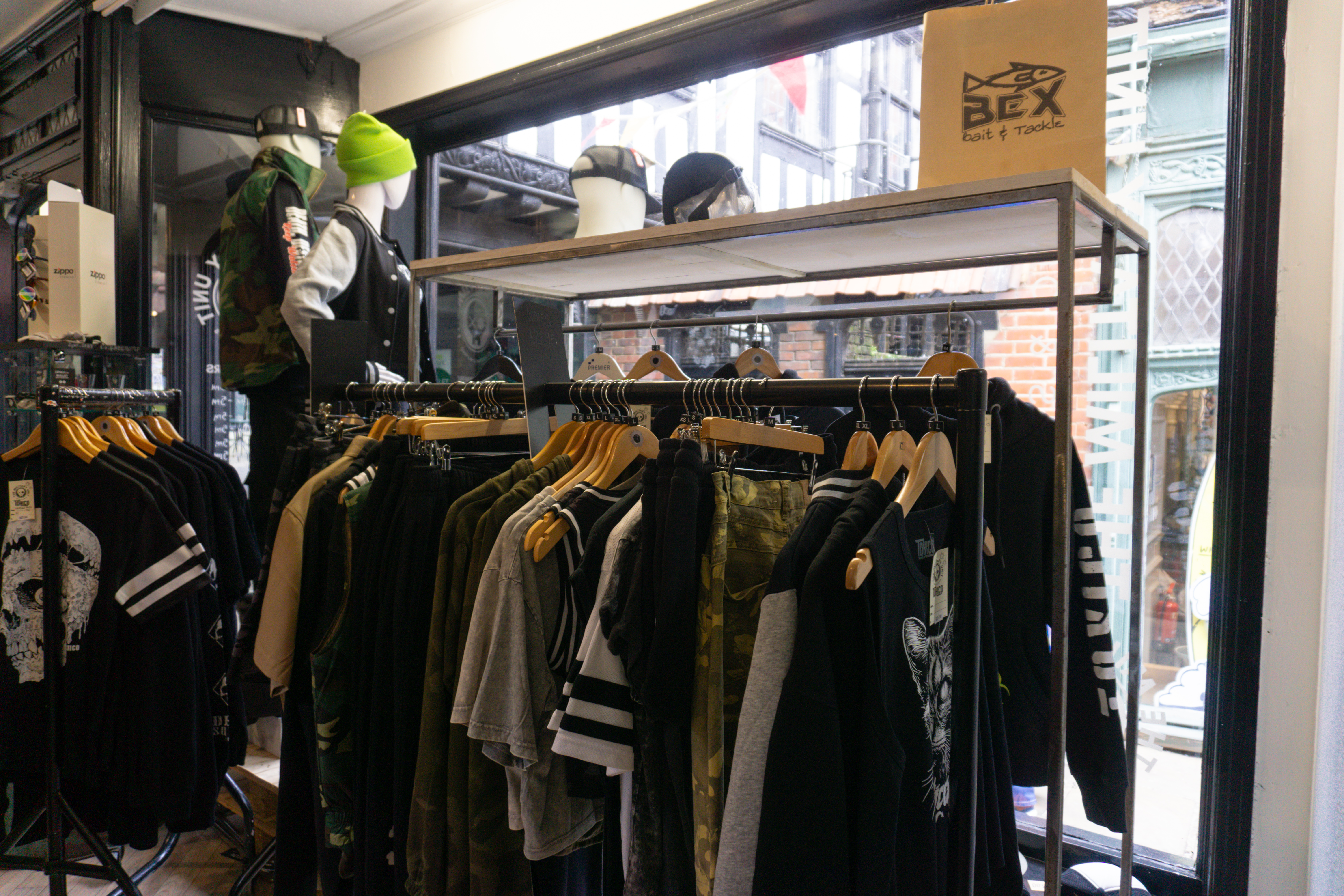 A bag donning the company's previous branding sits proudly on a shelf above a display