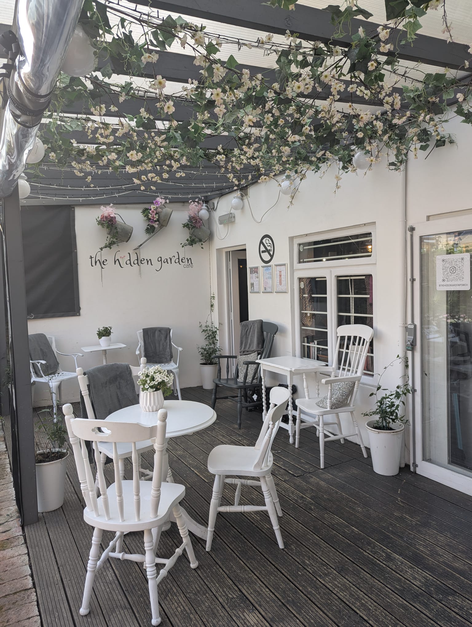 The pretty decked seating area overlooking The Hidden Garden