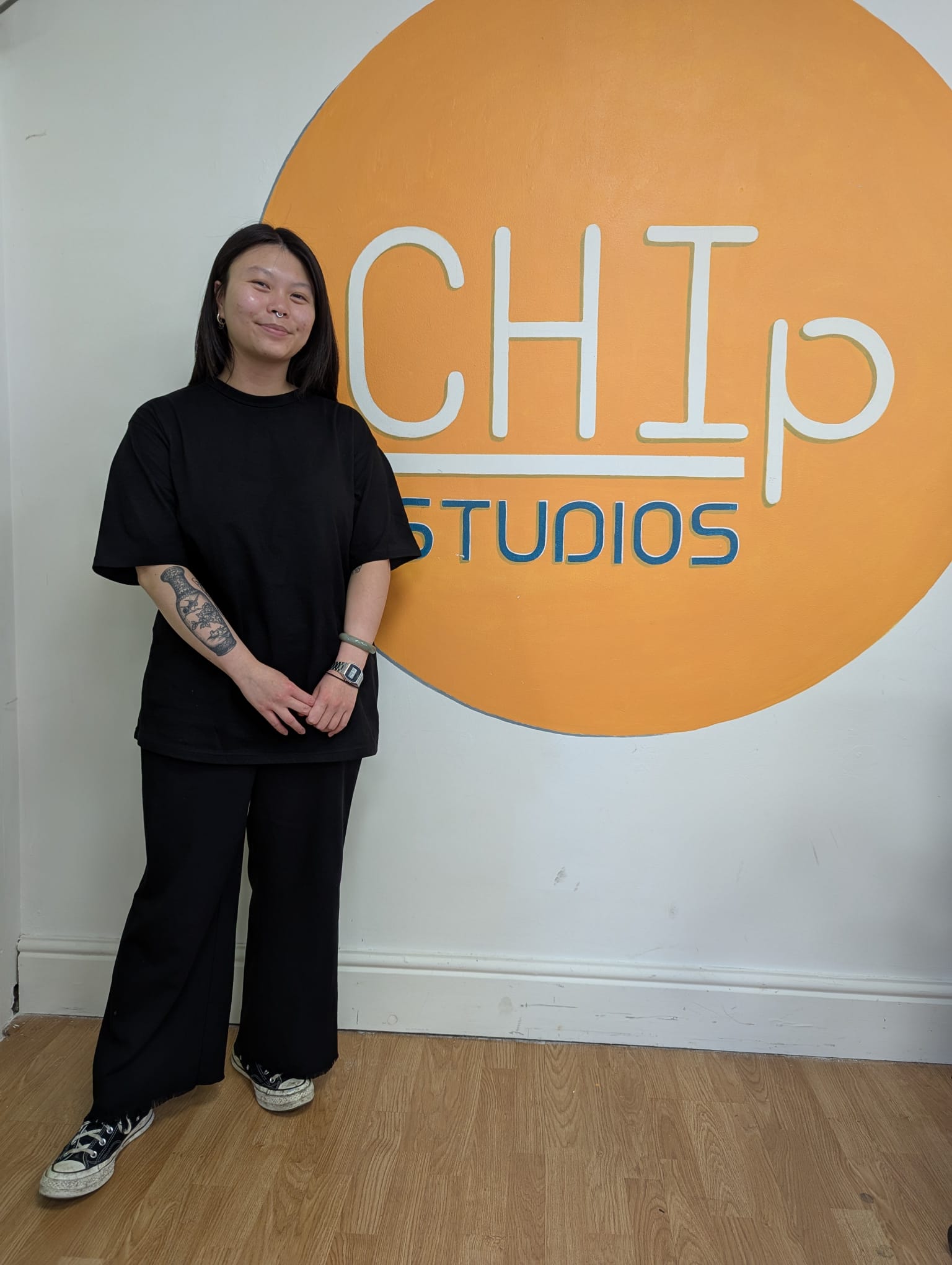 Suzanne Chung in front of CHIp logo