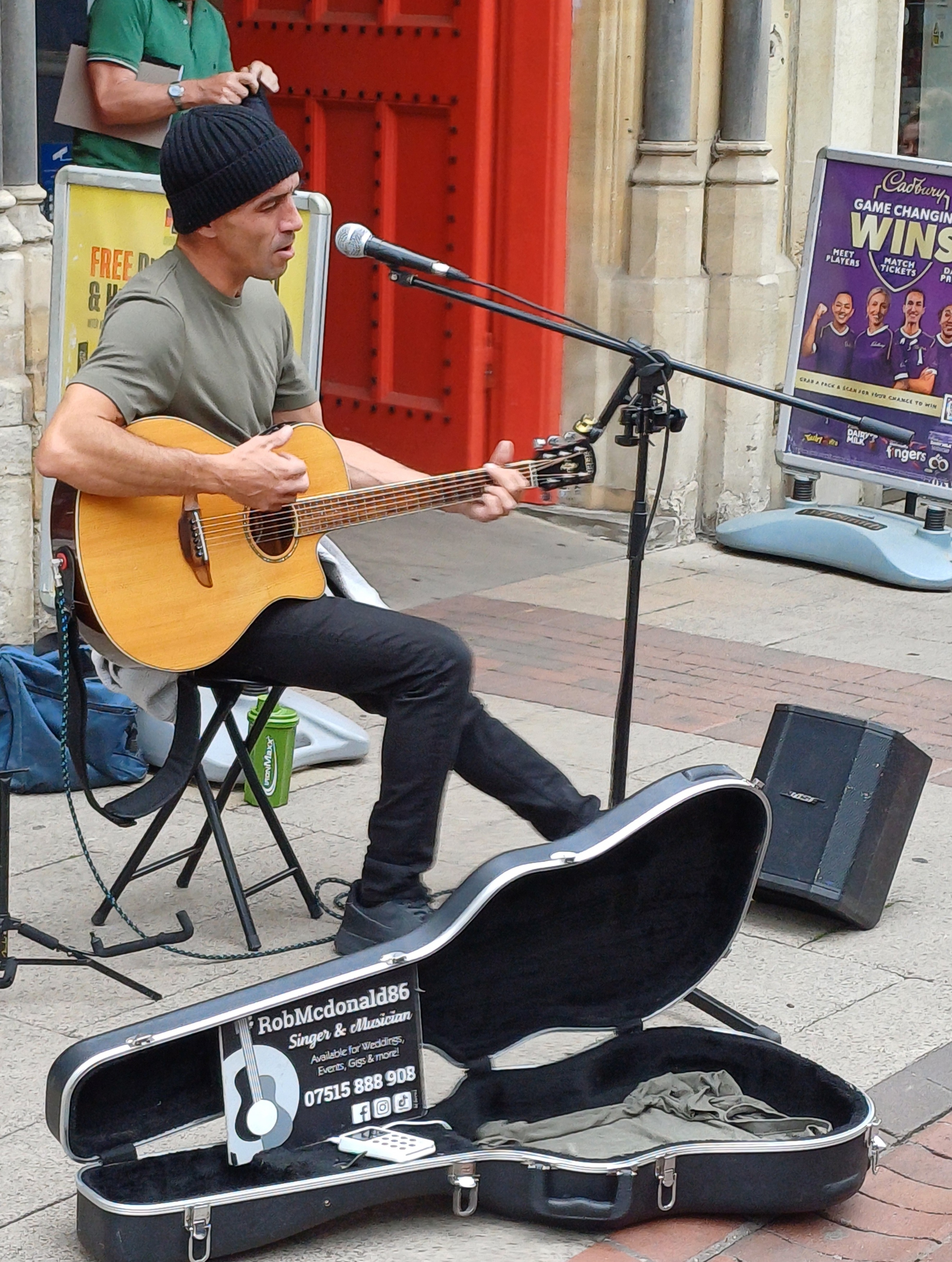 A busker performing in Ipswich town centre