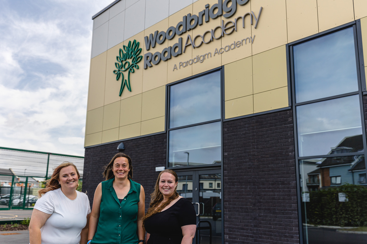 Staff outside Woodbridge Road Academy following it's first Oftsed report