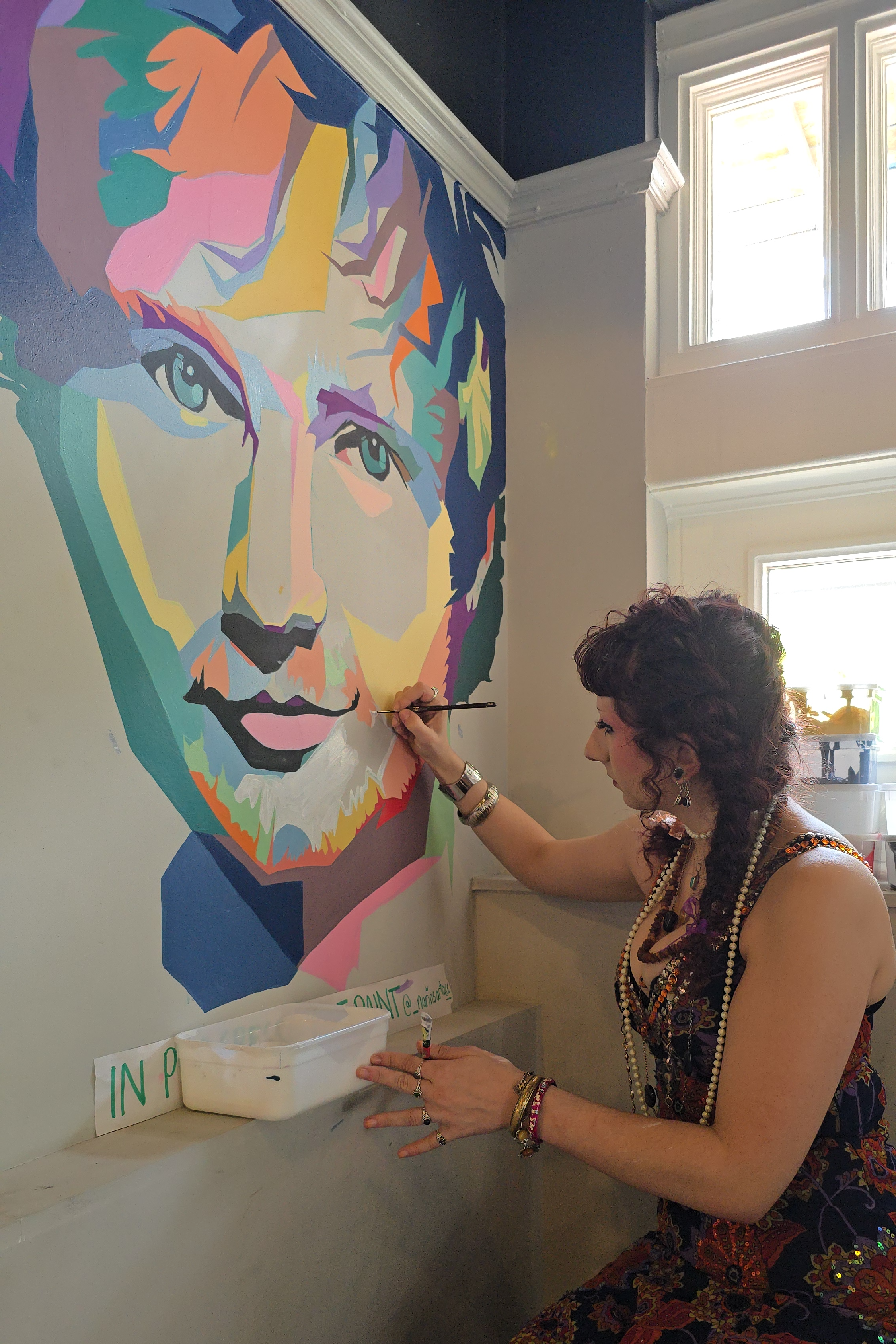 Ipswich artist Narin Naseri working on her Ed Sheeran mural at Tower Street Food Hall