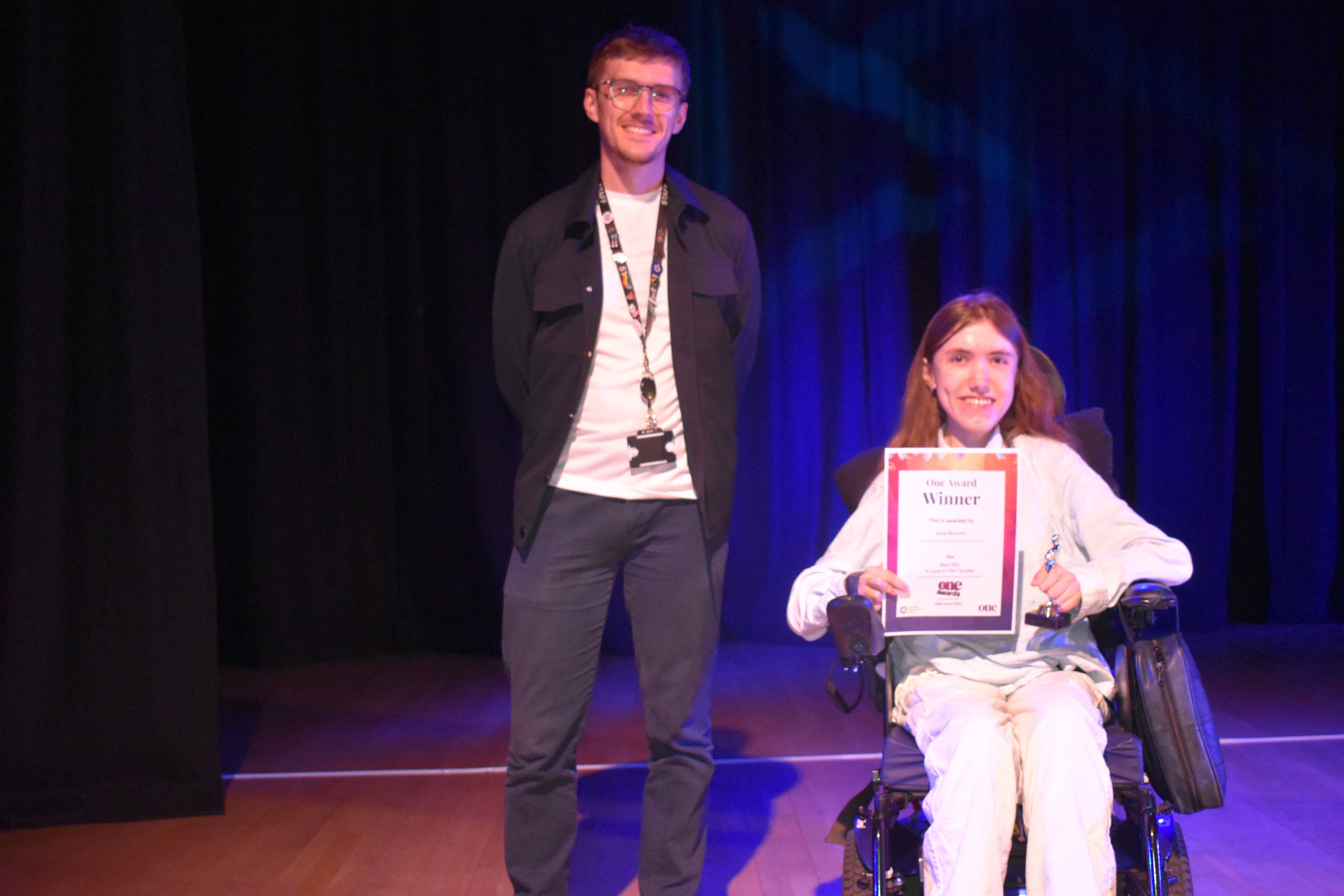 Katie Bennett picks up a film award at the One creative arts festival
