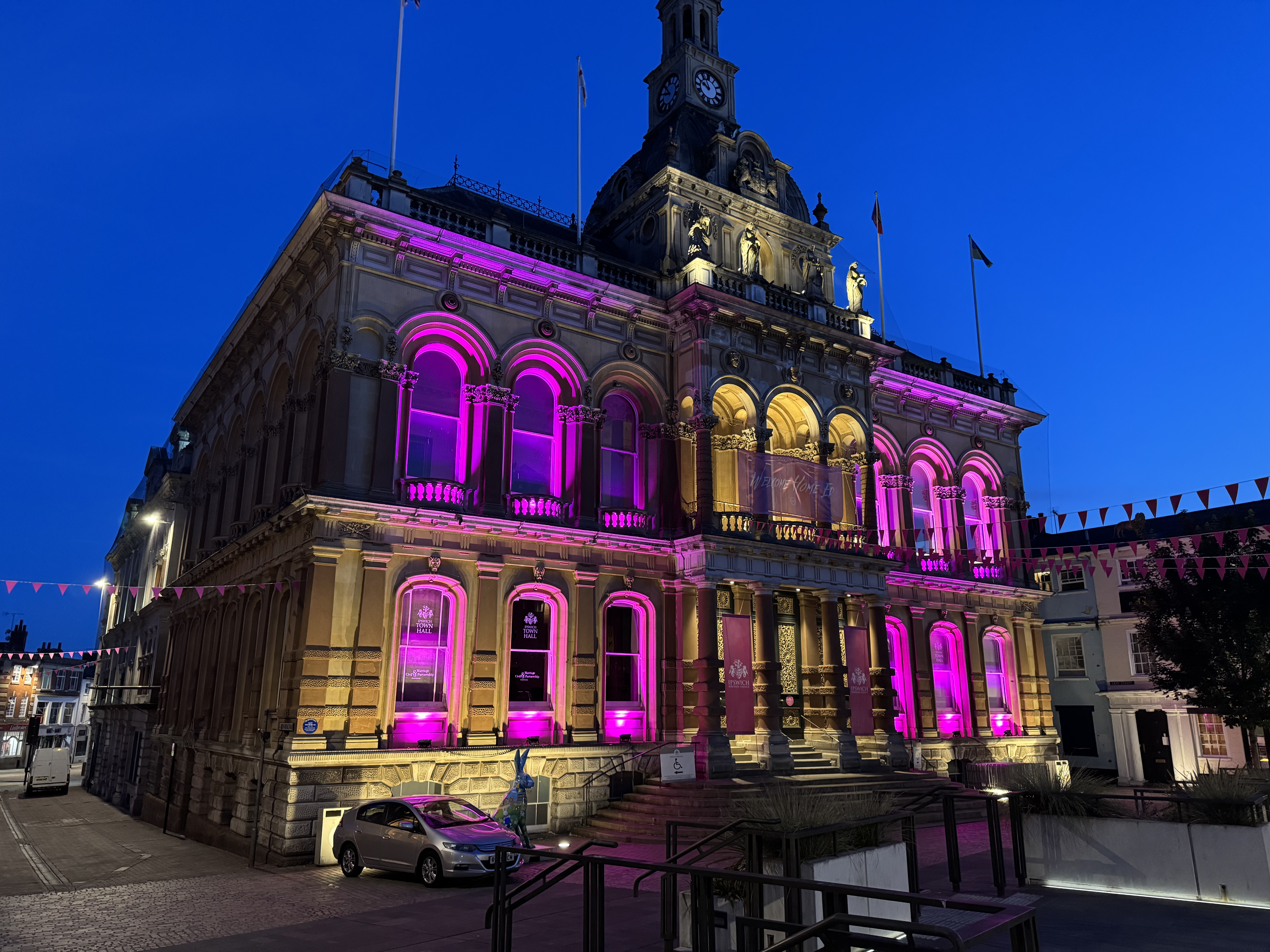 The town hall on Cornhill has been lit up pink