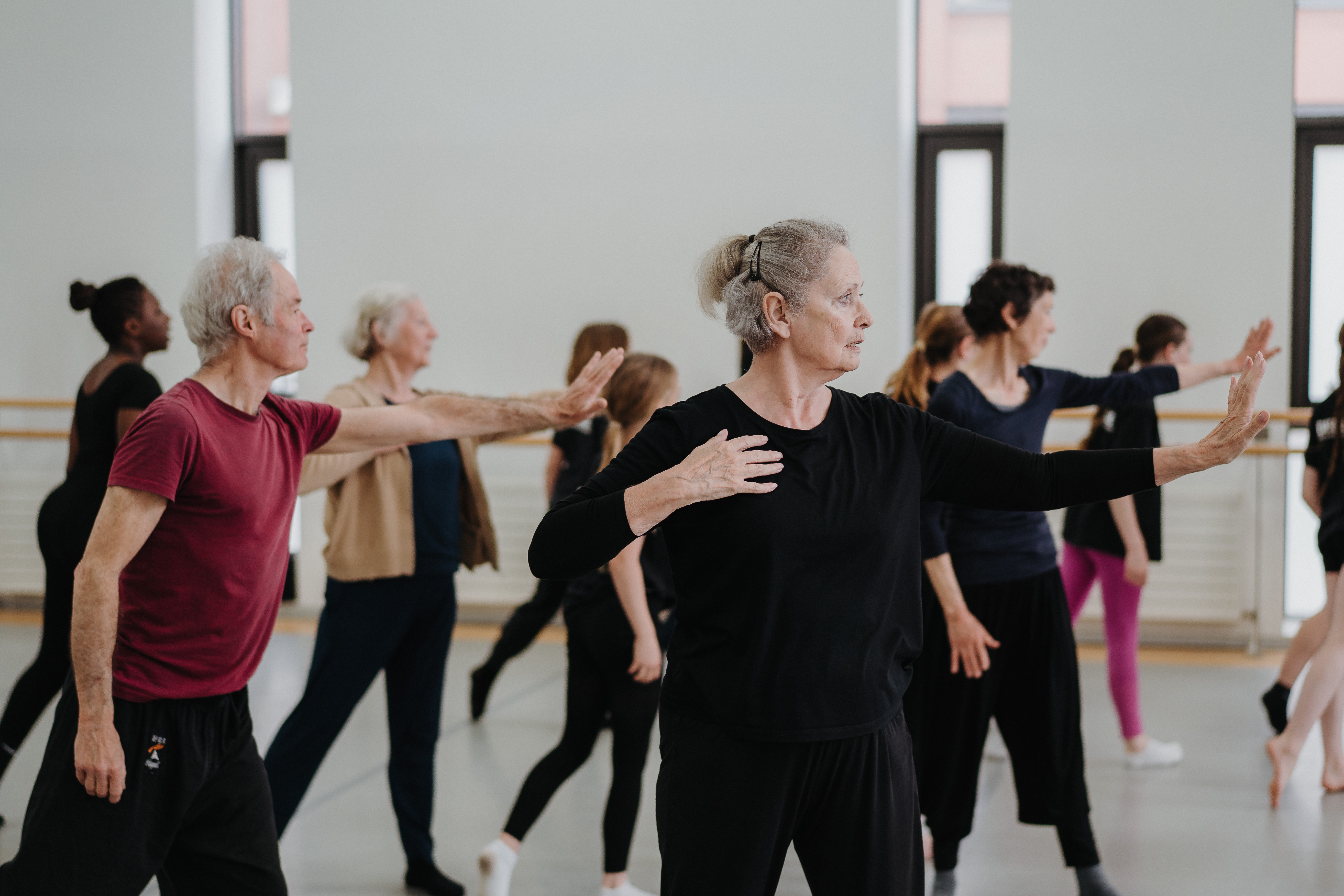 Dancers spanning seven decades moving together