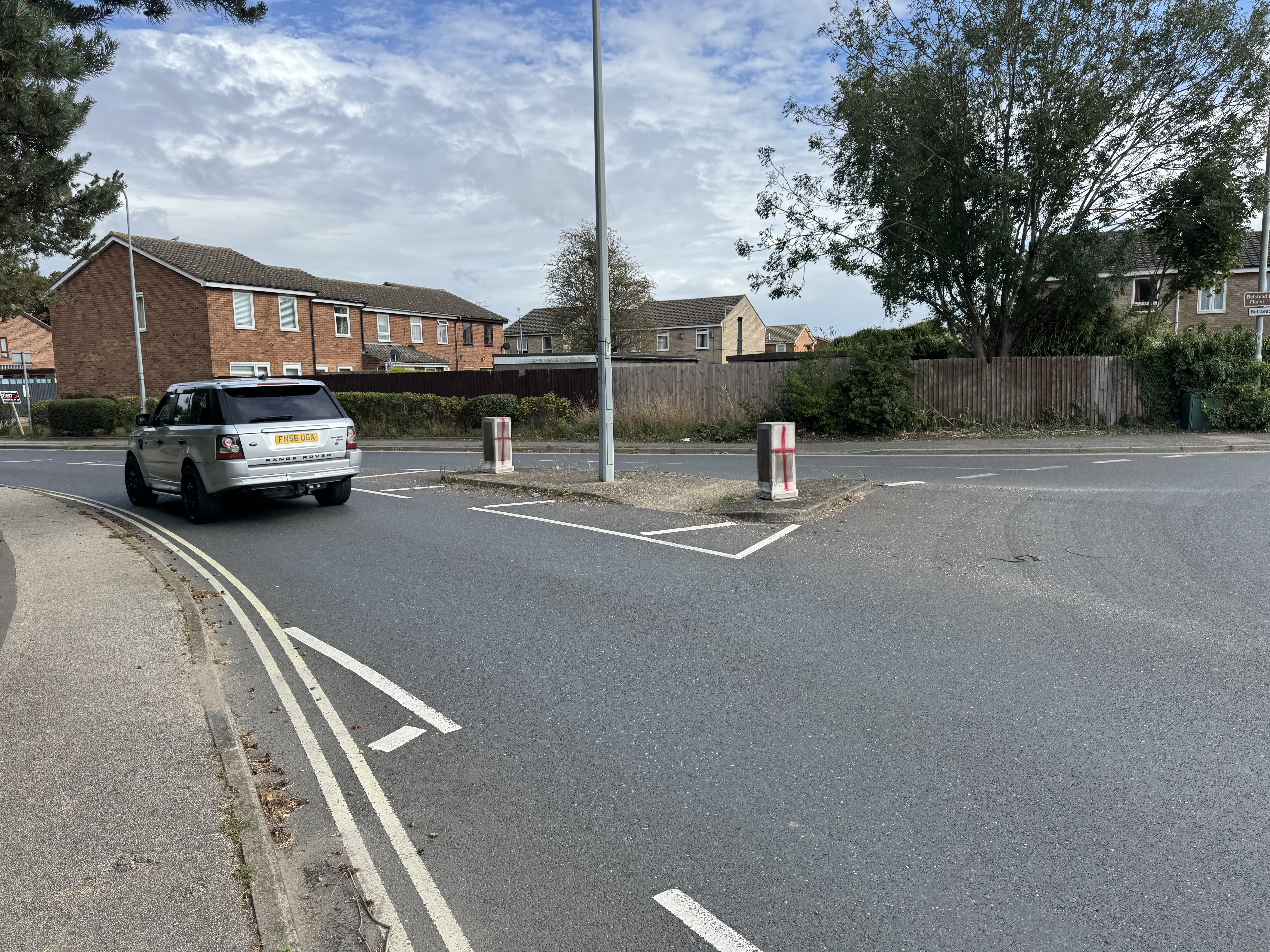 Bollards on Shepherd's Drive in Pinewood spray-painted with St George's Crosses