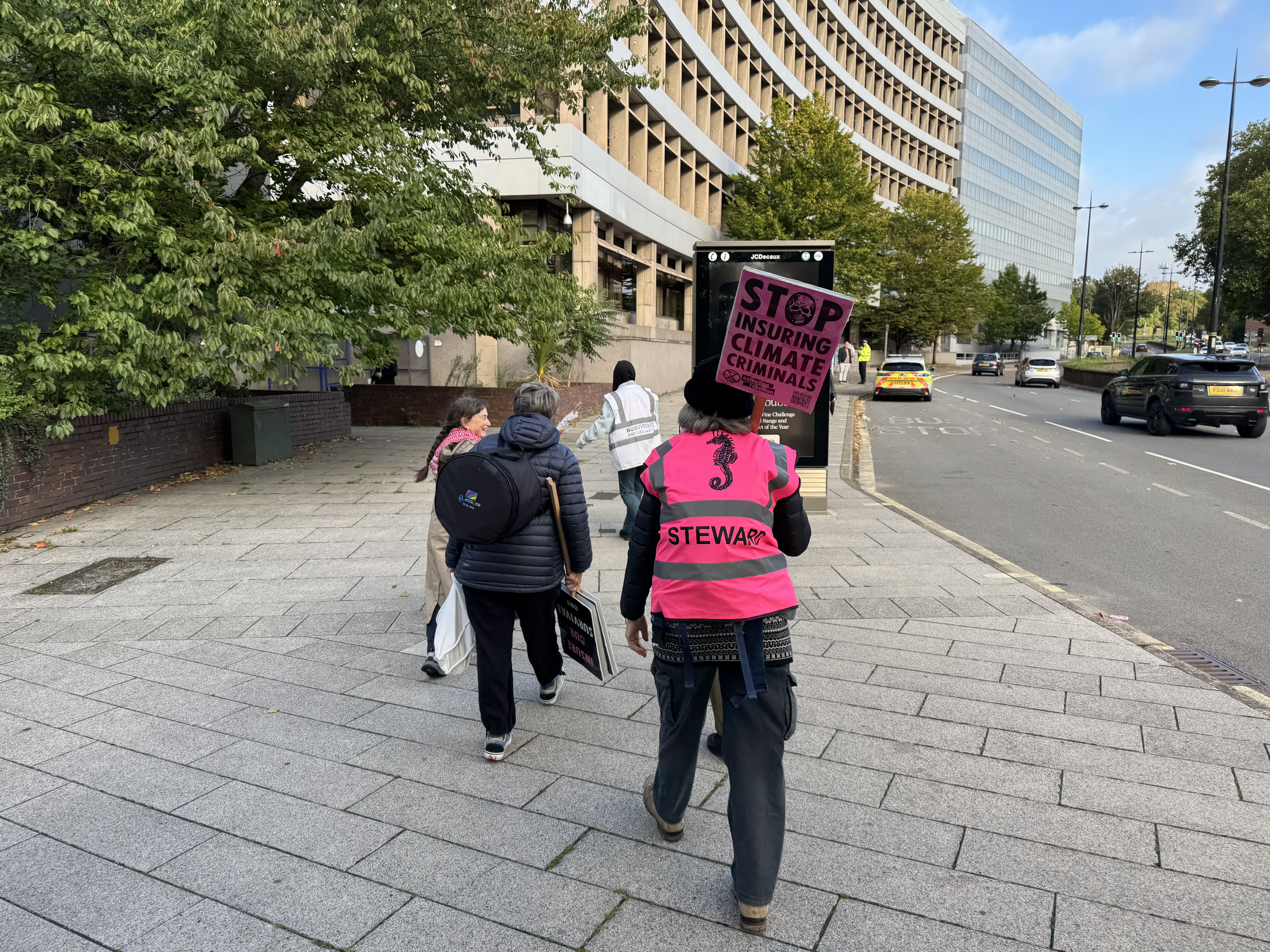 Extinction Rebellion activists on their way to the front of the AXA building on Civic Drive