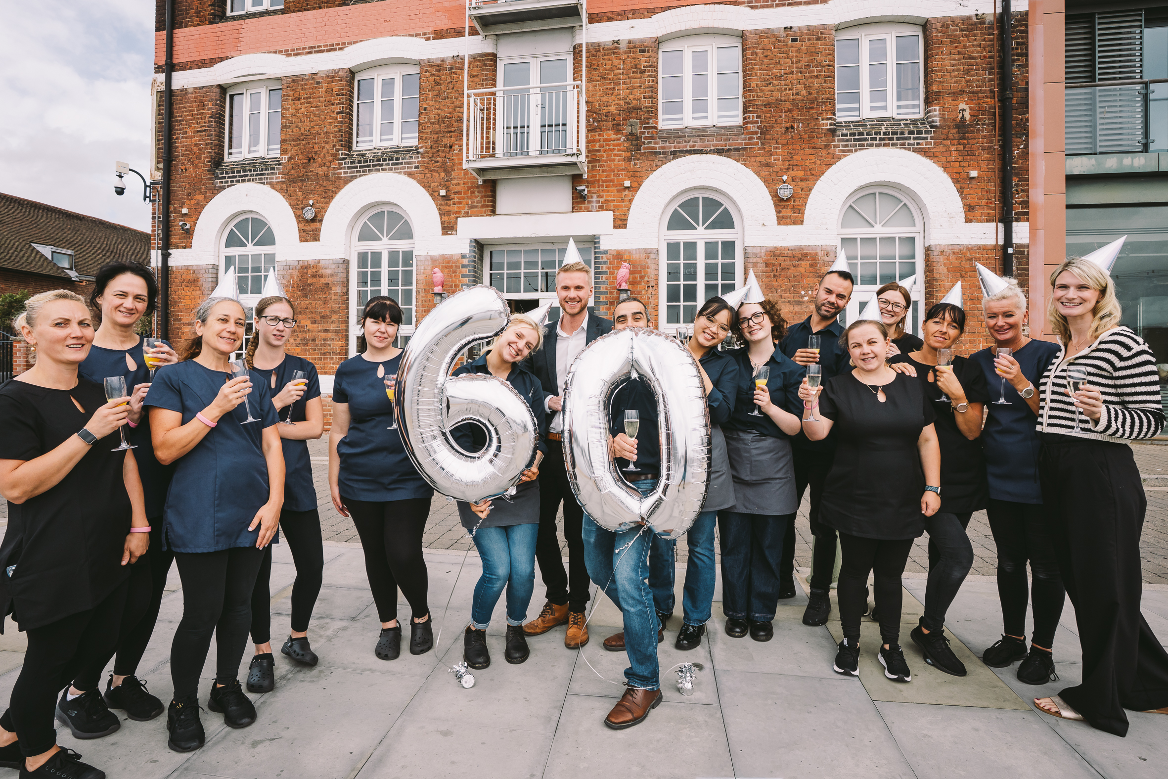 People celebrating outside building