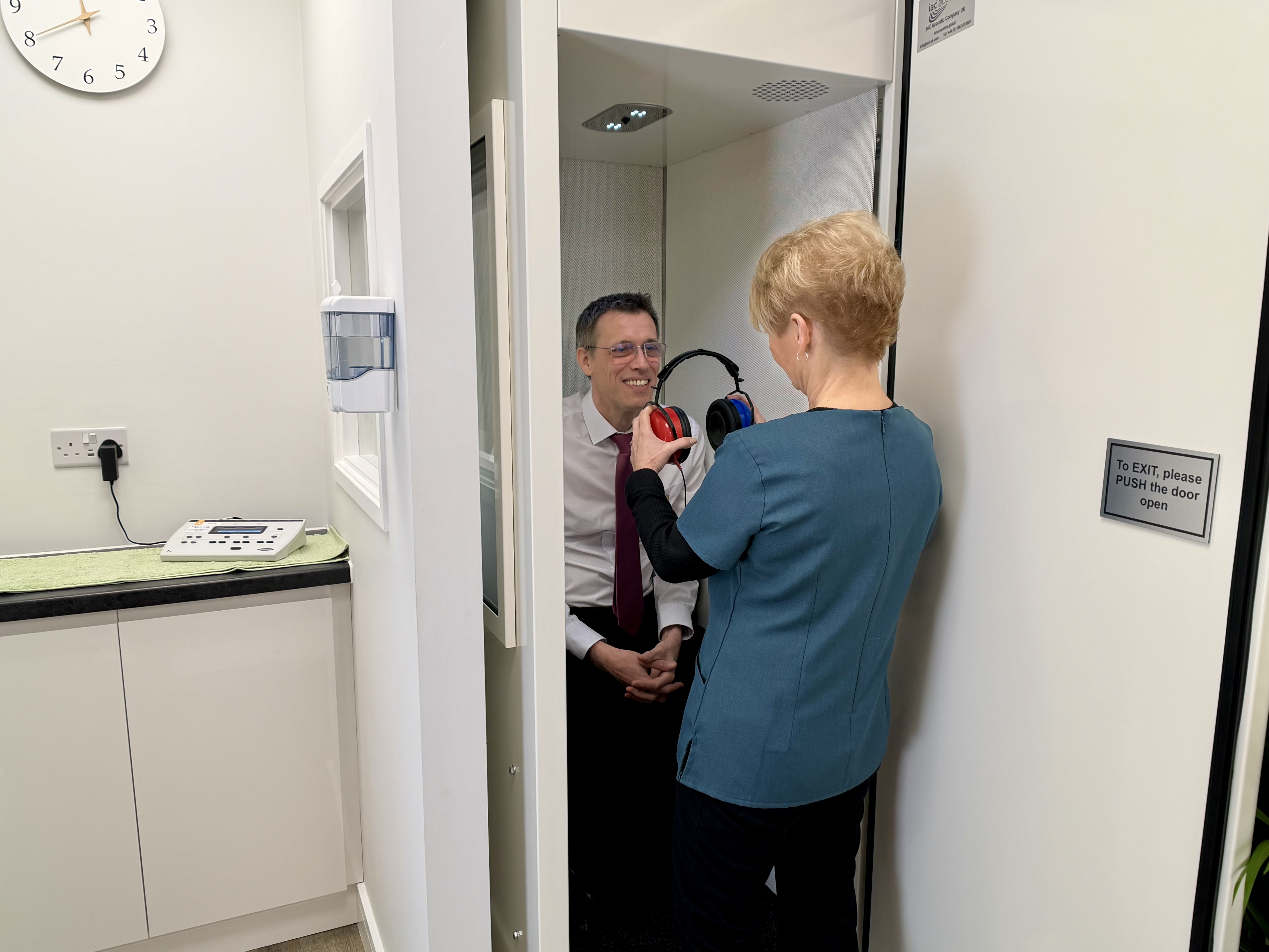 Audiologist Karen with Richard in the new audiology booth