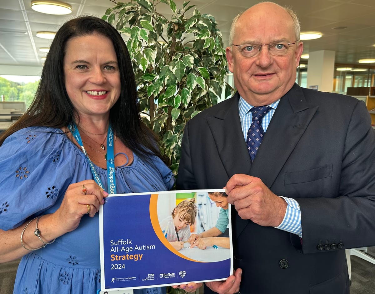 Cllr. Beccy Hopfensperger and Cllr. Andrew Reid holding a copy of the new strategy