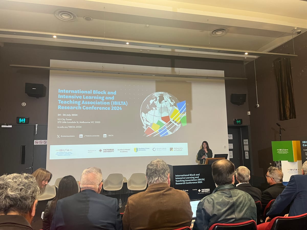 Photo of someone giving a talk a conference