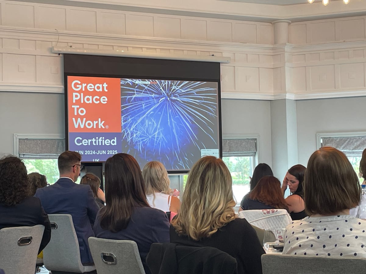 DPO Centre team viewing a presentation on being certified as a great place to work