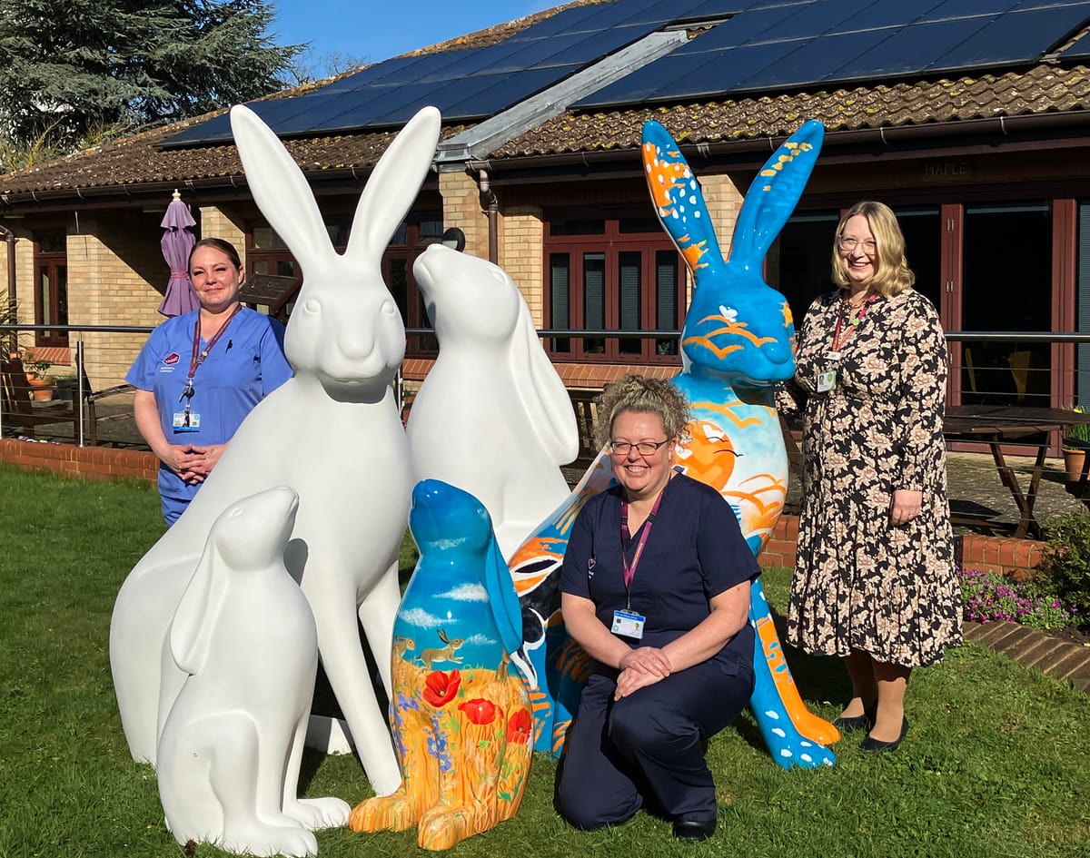 St Elizabeth Hospice CEO Judi Newman, right, and a few colleagues with some of the hare sculptures from the upcoming Hop to it! art trail