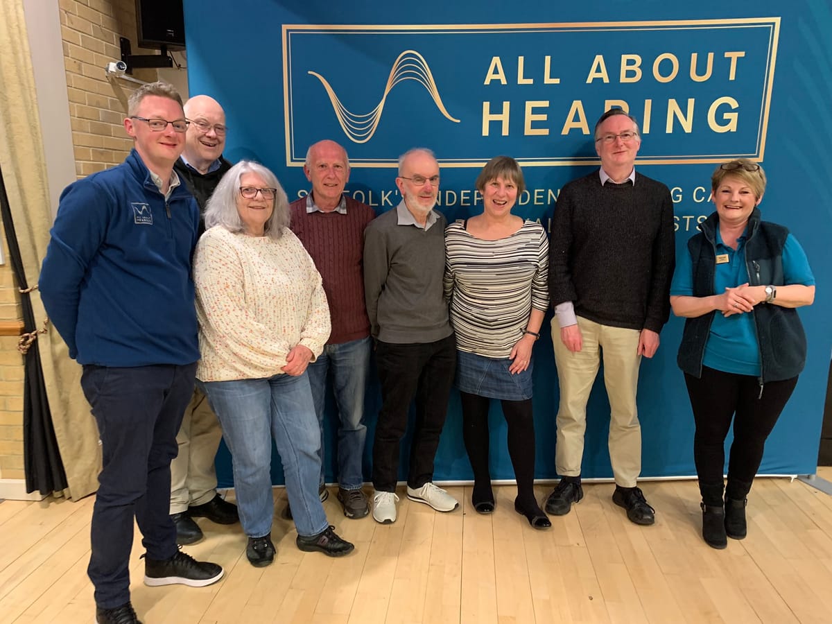 All About Hearing Directors, Matthew Coward and Karen Finch with quiz winners from April 2024