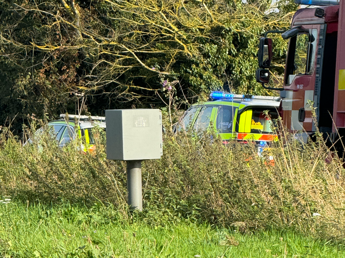Police and a search and rescue team in a layby in Bramford