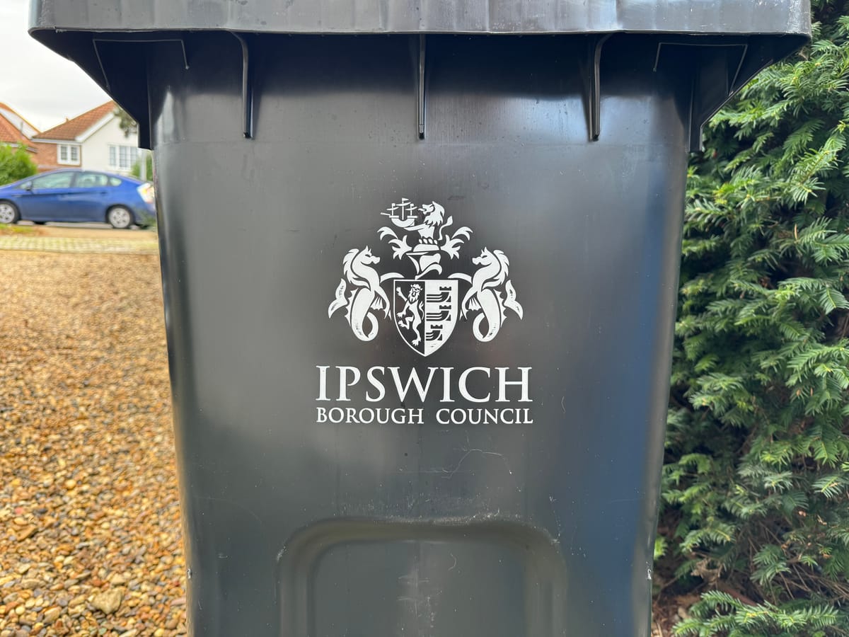 A black bin with the Ipswich Borough Council logo