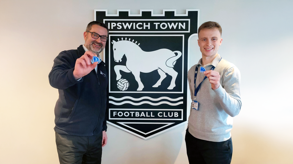 Jon Neal with Seb Norton, Supporter Engagement Executive at ITFC with the new "In Your Corner" badges