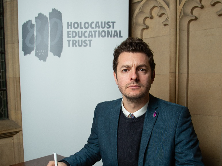 Jack Abbott signing the Holocaust Educational Trust's Book of Commitment