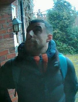 CCTV image of a man at someone's front door