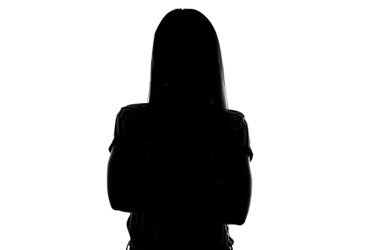 A silhouette of a female victim