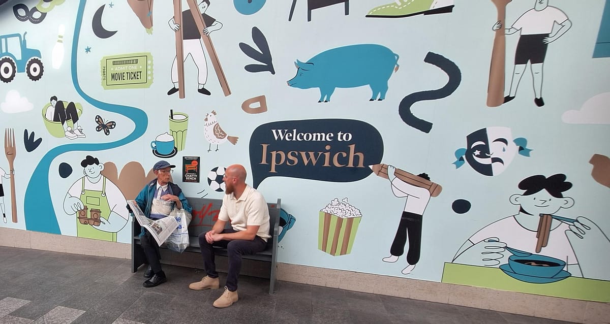 Security Manager Tyrone Candee on the chatty bench with a visitor