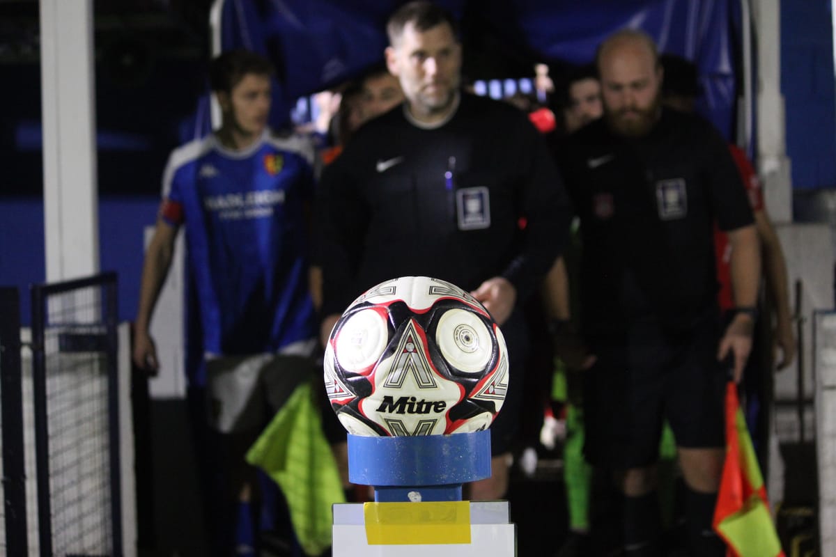 Ipswich Wanderers and Stowmarket Town players entering the pitch for their cup derby on 14 October 2025