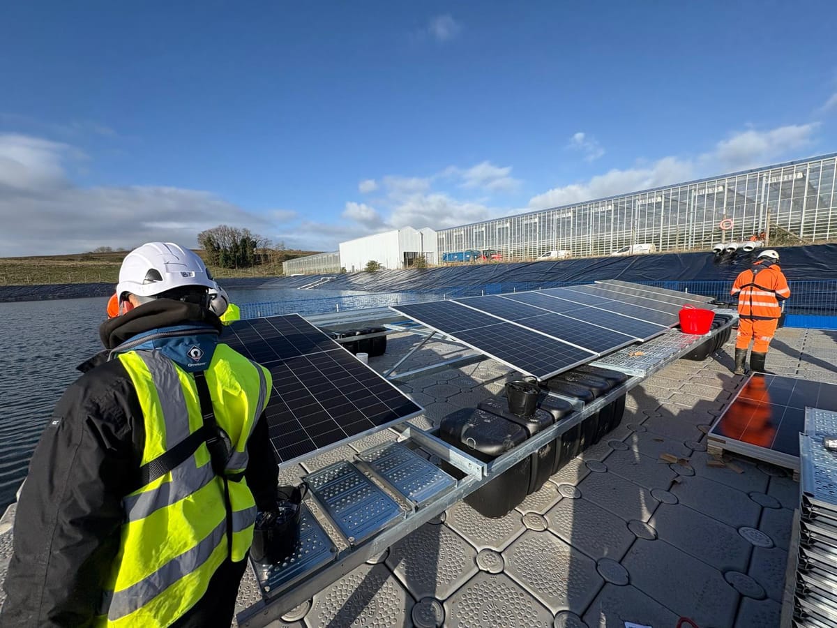 Workers in the early stages of installing the UK's largest solar pontoon at Fresh Suffolk in Bramford
