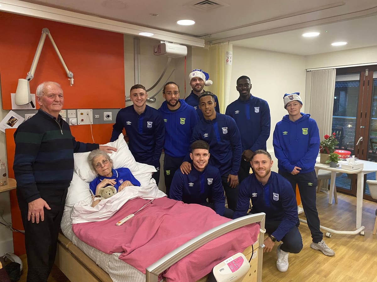 Charlie and Wendy with Blues players