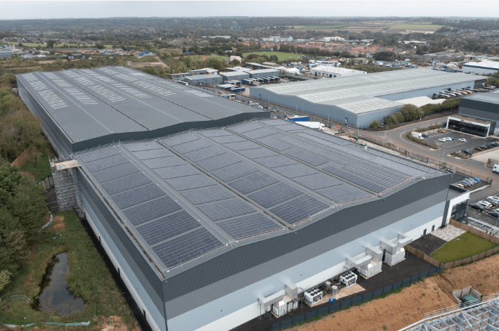 Birds eye view of building with solar panels
