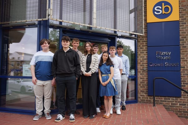 New trainees standing outside the Scrutton Bland office
