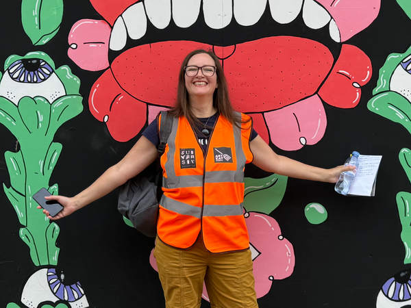 Sarah Hayes in front of some street art