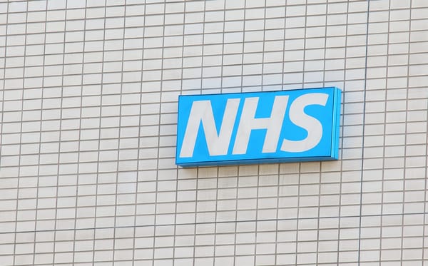 NHS sign on a building