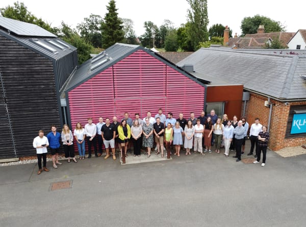 The KLH team outside their office