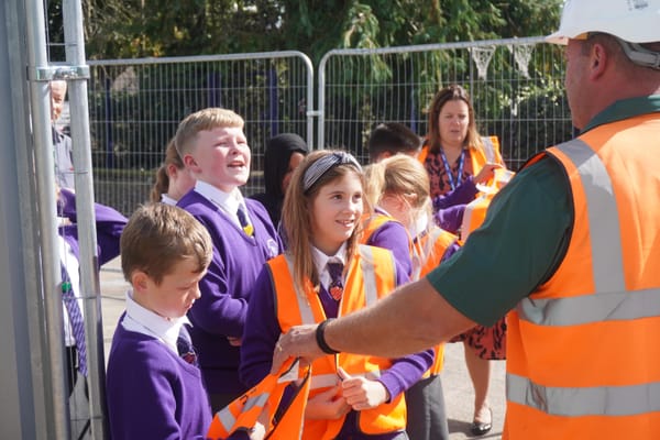 Children at Martlesham Primary Academy donned hard hats and hi vis for their tour of the new classroom